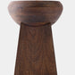 Wooden bowl on a wooden pedestal against a white background