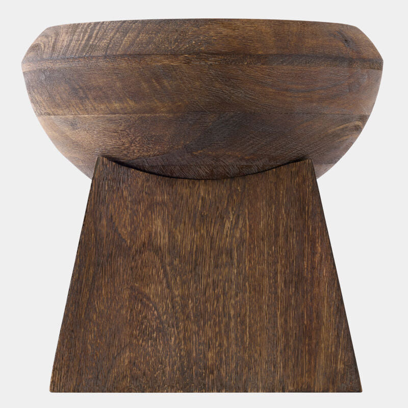 Wooden stool with a bowl-like top on a white background