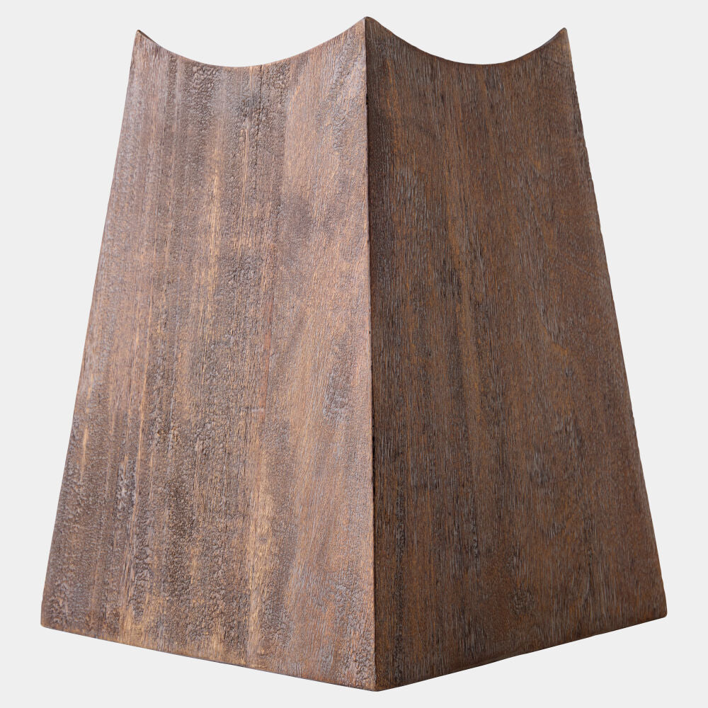 A modern sculptural table lamp shade made of textured dark brown wood, shown against a plain light gray background.
