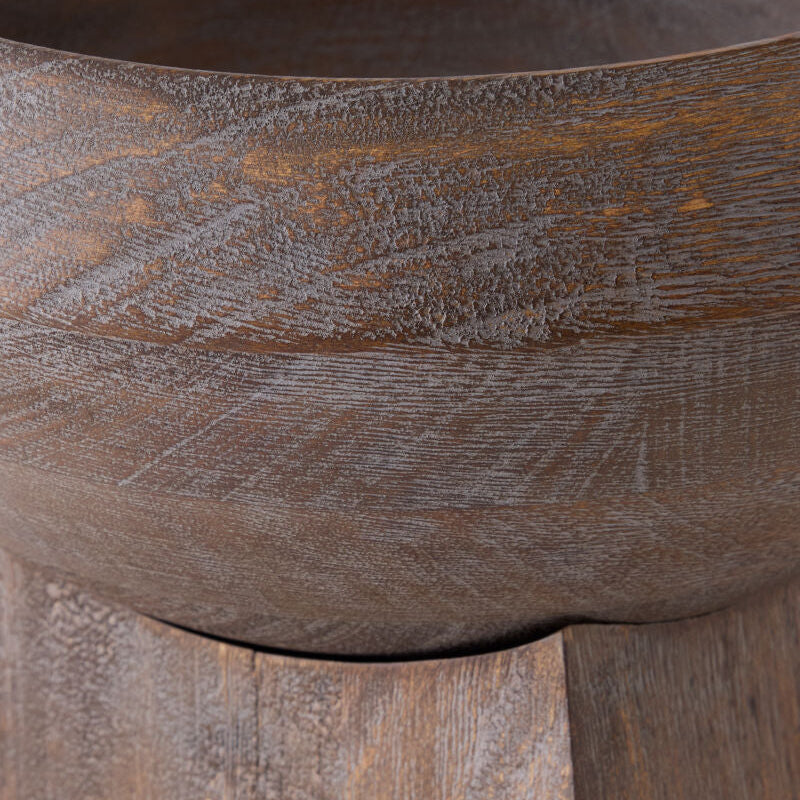 Close-up of a dark brown wooden bowl with visible wood grain texture and a matching wooden base.