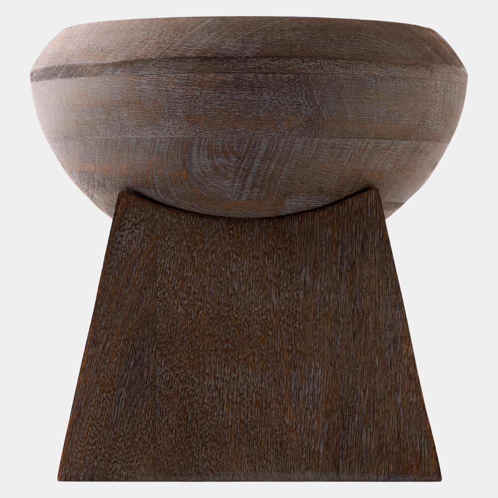 A rustic wooden pedestal stool with a rounded bowl-shaped seat and a wide, tapered block base, shown against a plain light gray background.