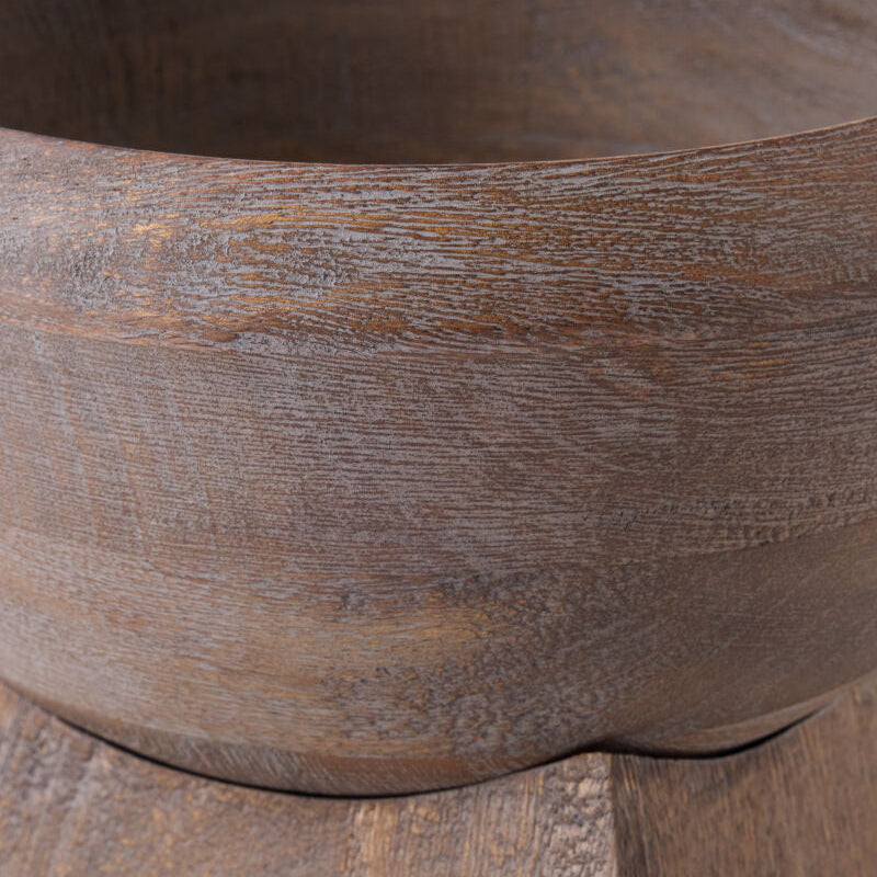 Close-up of a rustic wooden bowl showing the detailed wood grain texture and natural brown color.
