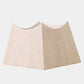 Beige and white skirt on a light gray background