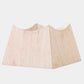 A light beige textured fabric lampshade with a wavy, scalloped top edge, shown against a plain light gray background.