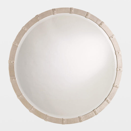 Round mirror with decorative beige border on a white background