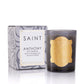 Candle with gold design and packaging labeled 'Saint Anthony of Padua' on a white background