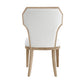 Chair with white cushioned backrest and seat on a white background
