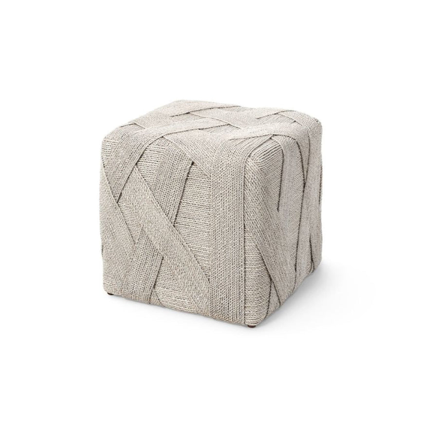 Textured cube-shaped ottoman on a white background