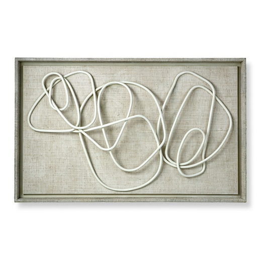Framed abstract art piece with white lines on a beige background