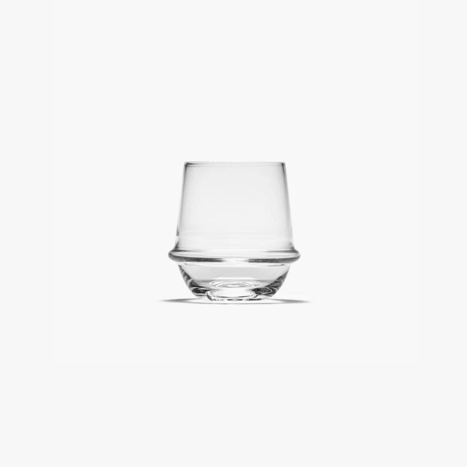 Clear glass tumbler on a white background