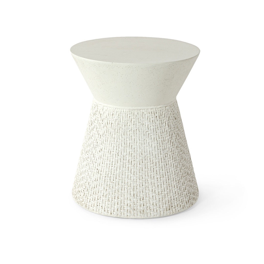 White textured side table on a white background