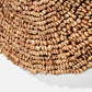 Close-up of a textured brown wall art on a white background