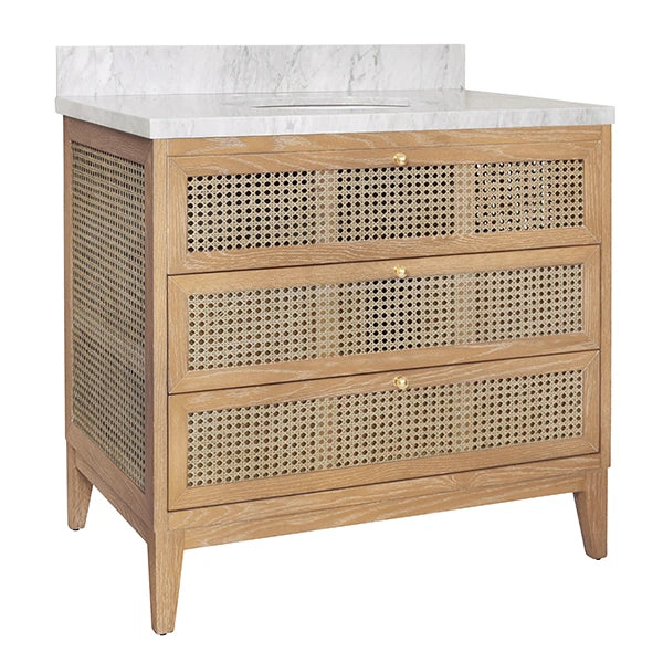 Wooden vanity with marble countertop and rattan-style drawers on a white background