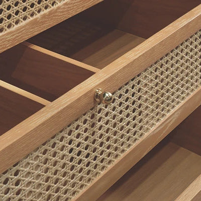 Wooden cabinet with open drawer featuring woven design