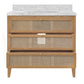 Bathroom vanity with marble countertop and rattan drawers on a white background