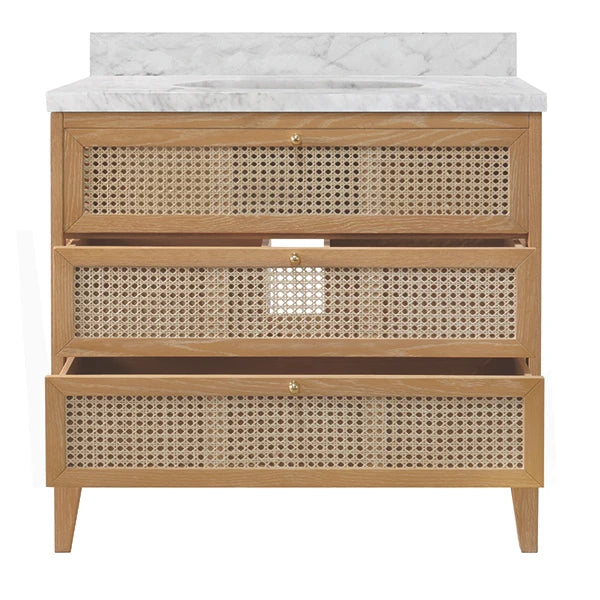 Bathroom vanity with marble countertop and rattan drawers on a white background