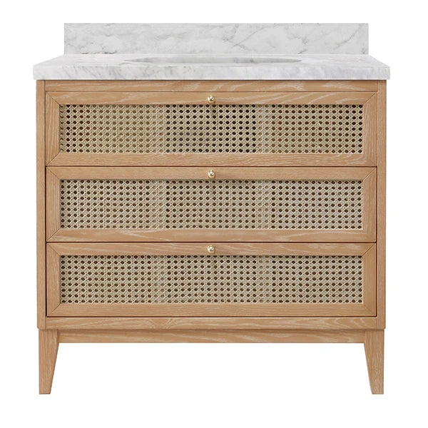 Wooden vanity with rattan drawers and marble countertop on a white background