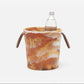 blue pheasant Wesley ice bucket with a marble pattern holding a clear bottle on a white background