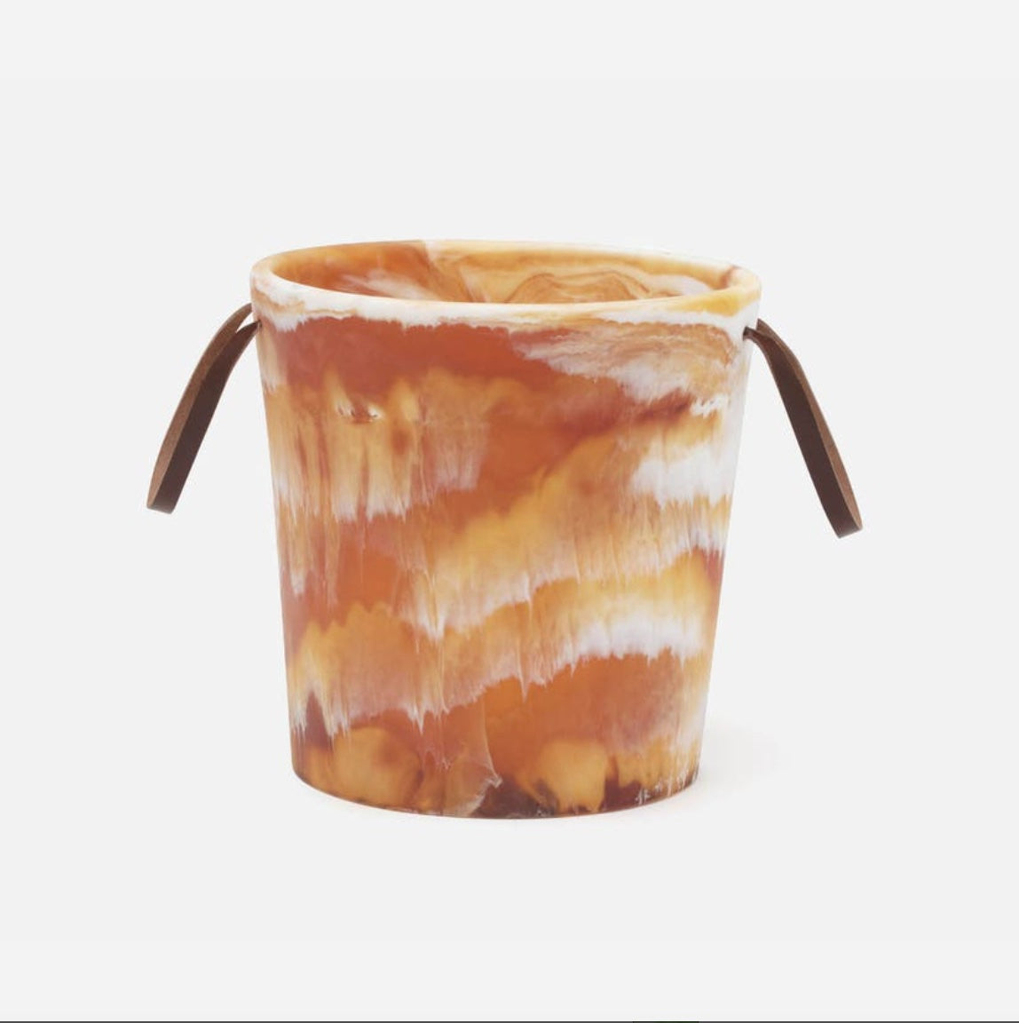 Marbled patterned bucket with brown handles on a white background