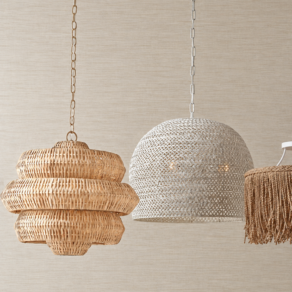Three woven pendant light shades hanging against a beige textured wall: a natural tan tiered basket shade on the left, a white woven dome shade in the center, and a tan fringe lamp on the right.