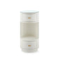 A modern cylindrical side table with a white wood grain finish, featuring two drawers with small gold handles and a clear glass top, set against a plain white background.