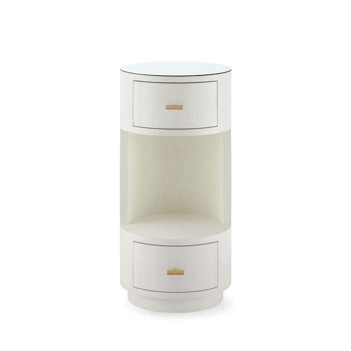 A modern cylindrical side table with a white wood grain finish, featuring two drawers with small gold handles and a clear glass top, set against a plain white background.