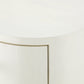 Close-up detail of a white textured cabinet or sideboard with a curved front panel and a visible seam.