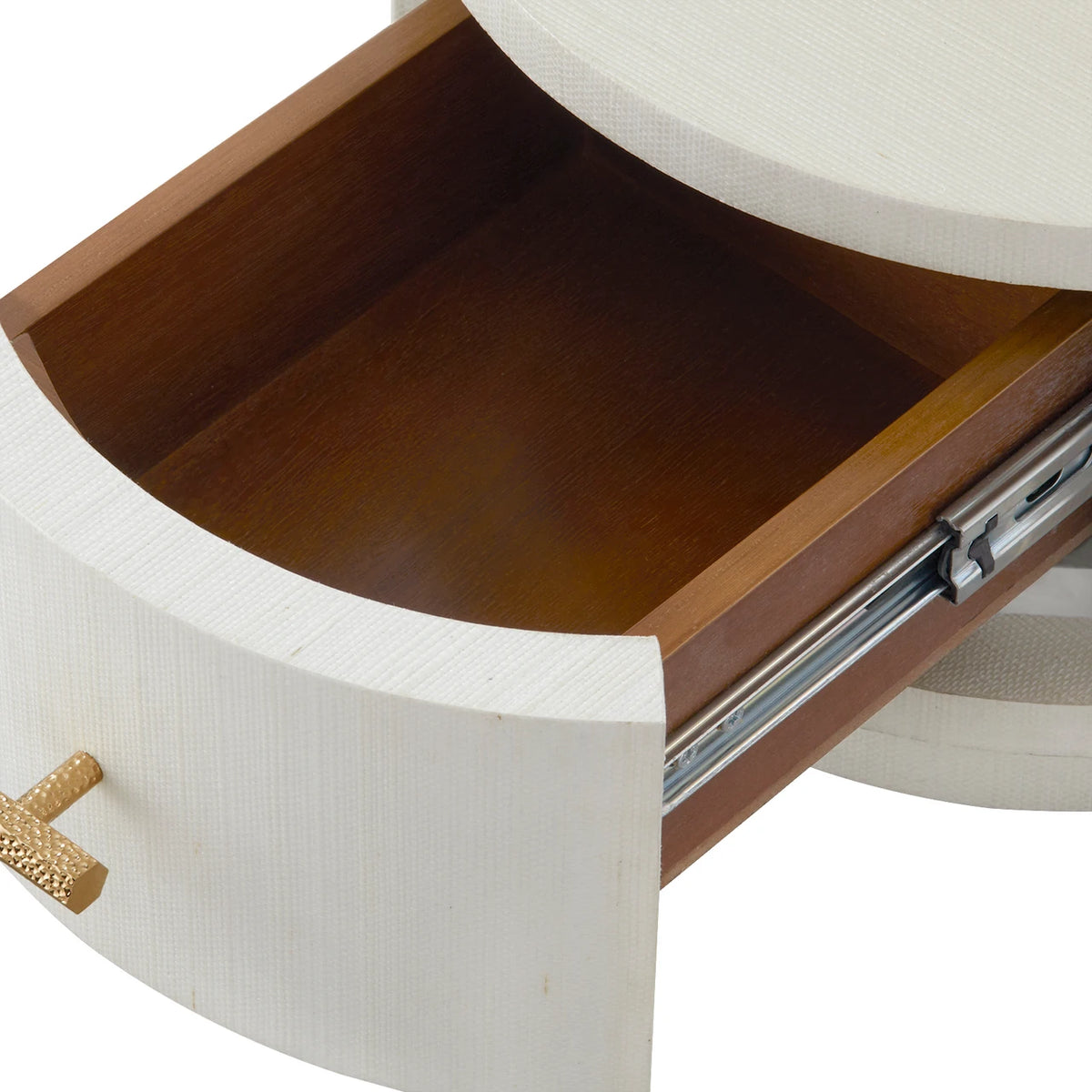 Wooden drawer with white exterior and gold handle on a white background