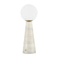 A modern table lamp featuring a tapered, textured off-white base and a spherical frosted white glass shade, accented by a small gold collar at the top.