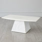White marble dining table on a wooden floor with a neutral background