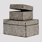 Set of three decorative boxes with a patterned design on a light gray background