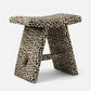 Stool with cheetah print pattern on a white background