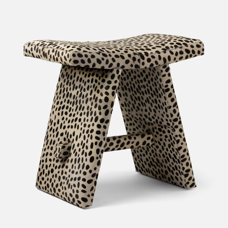 Stool with cheetah print pattern on a white background