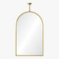 Gold-framed arch mirror on a white background