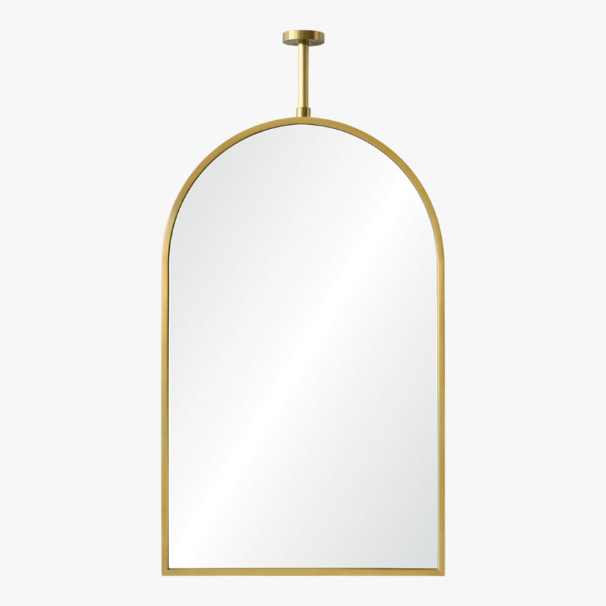 Gold-framed arch mirror on a white background