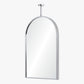 Arch-shaped mirror with chrome frame on a white background