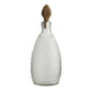 Decorative bottle with textured design and wooden cap on a white background