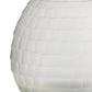 Close-up of a white, layered lampshade on a white background