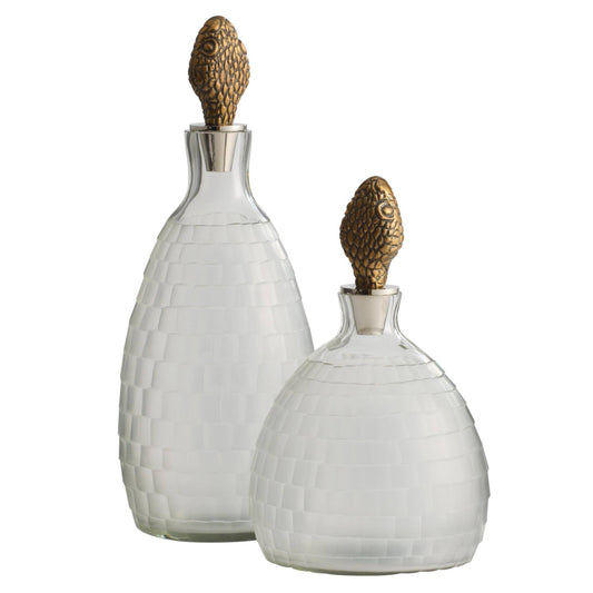 Two decorative bottles with textured design and gold accents on a white background