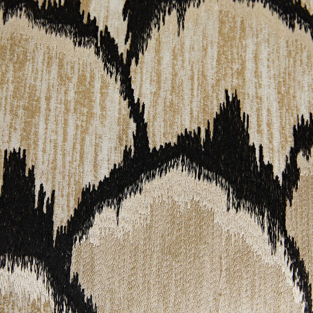 Close-up of a textured fabric with black and beige pattern