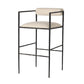 Bar stool with black metal frame and beige cushioned seat on a white background