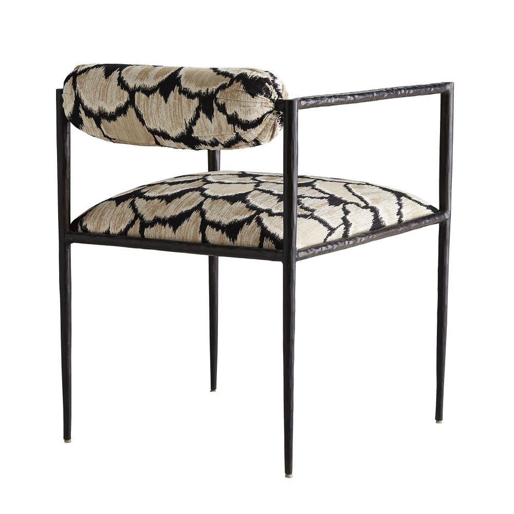Chair with patterned cushion and metal frame on a white background