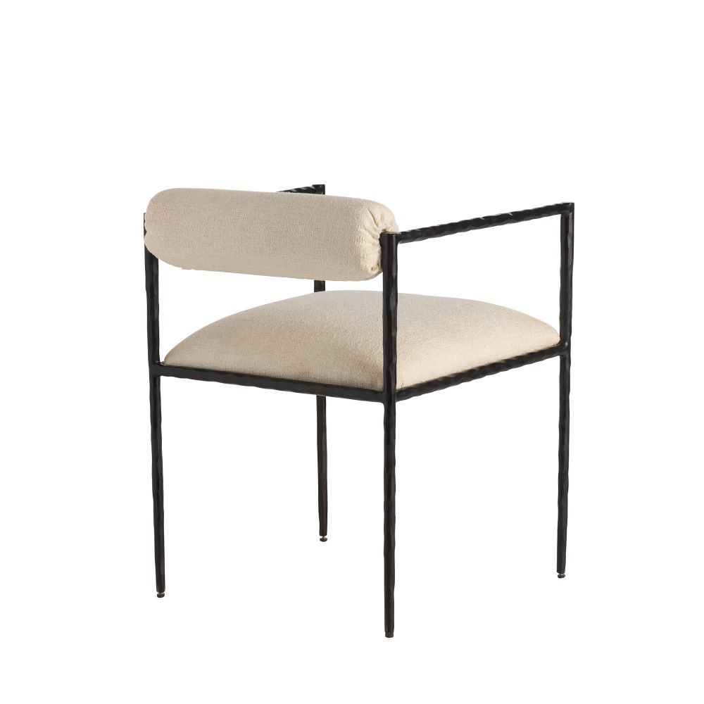 Chair with black frame and beige cushion on a white background