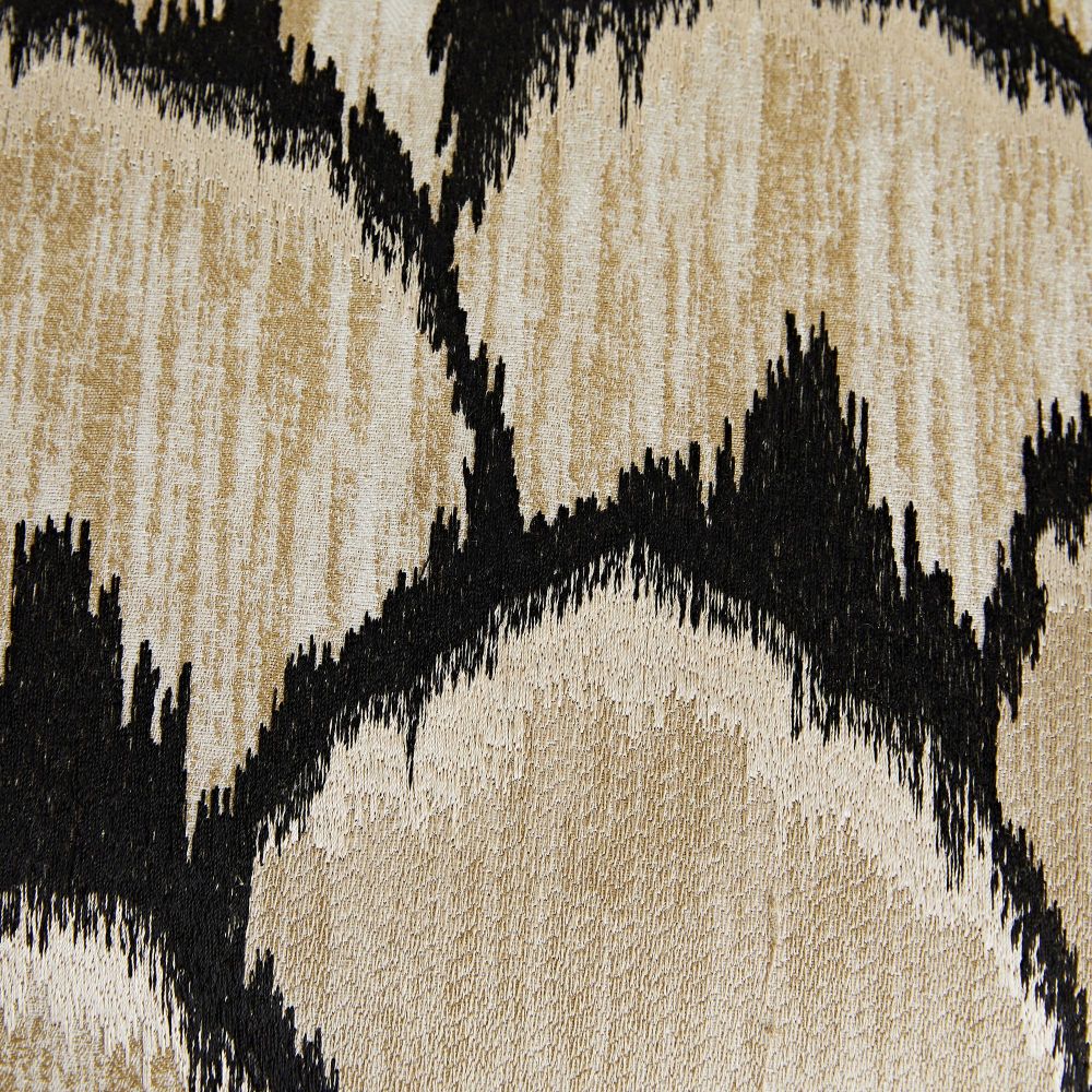 Close-up of a textured fabric with black and beige pattern