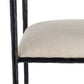 Close-up of a chair with a black frame and beige cushion on a white background
