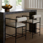 Three bar stools with white cushions in front of a marble countertop.