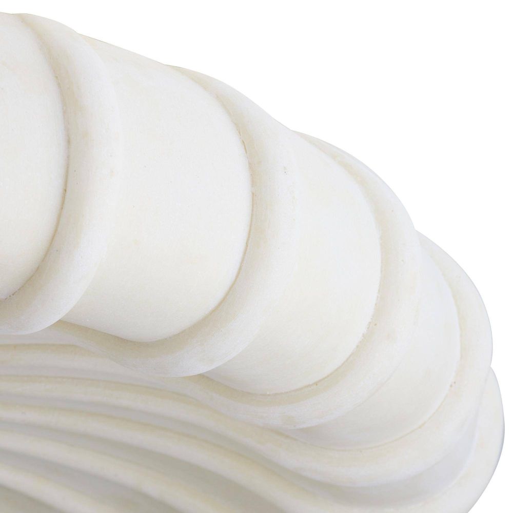 Close-up of a white, wavy surface texture