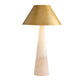 Table lamp with a gold shade and beige base on a white background