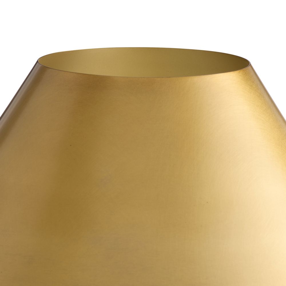 Close-up of a gold lampshade on a white background