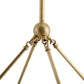 Close-up of a gold decorative object with a spherical top and four arm-like extensions on a white background.
